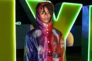 Jaden Smith Bursts With Color in Rainbow Raincoat & New Balance Sneakers for Nylon House in the Desert 2023 During Coachella