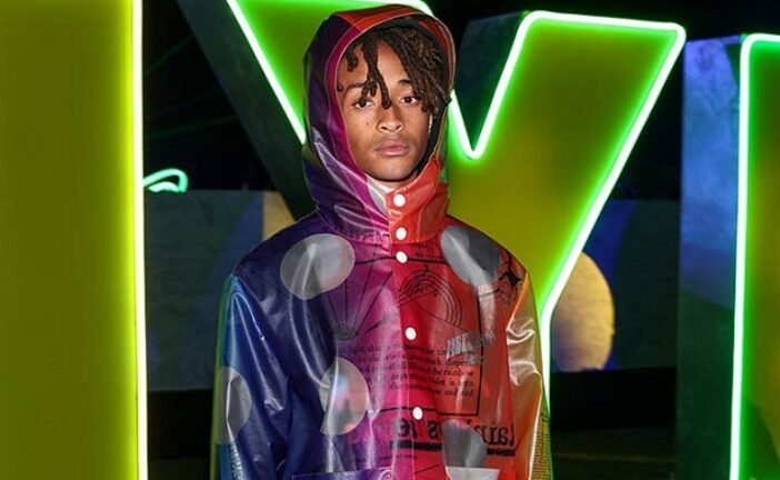 Jaden Smith Bursts With Color in Rainbow Raincoat & New Balance Sneakers for Nylon House in the Desert 2023 During Coachella
