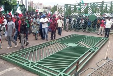 BREAKING: Protesters Pull Down NASS Gate, Take Over Premises