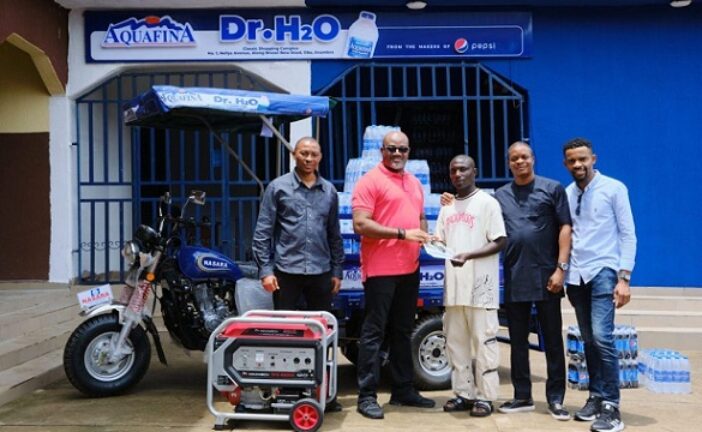 Aquafina Empowers Viral Hawker, Dr. H20, Rewards Him With Full Business Setup Worth Millions Of Naira